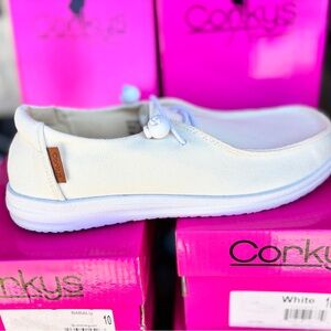 Colors Tan or White listing Kayak slide on sneakers by Corkys